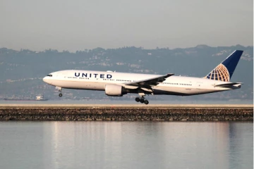 லேப்டாப்பால் நடுவானில் விமானத்தில் தீவிபத்து: நால்வர் காயம்