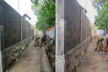 கிளிநொச்சியில் பொது வீதியில் சட்டவிரோத மதில் அமைத்துள்ள நபர்: எதிர்ப்பு வெளியிட்டுள்ள மக்கள்