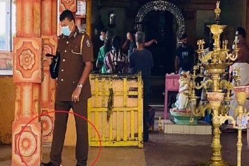 யாழின் பிரபல ஆலயத்தின் புனிதத்தை உதாசீனம் செய்த  பொலிஸ் அதிகாரி; வெடித்த சர்ச்சை!