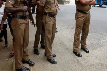 பொலிஸ் உயர் அதிகாரியின் கையைக் கடித்து தலைமறைவான பெண்