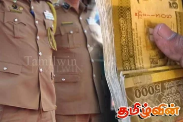 பொலிஸ் அதிகாரிக்கு இலஞ்சம் வழங்கிய இருவர் கைது