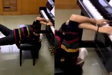 தலைகீழாய் தொங்கிய படி பியானோ வாசிக்கும் இளம்பெண்! மெய்சீர்க்க வைக்கும் காட்சி