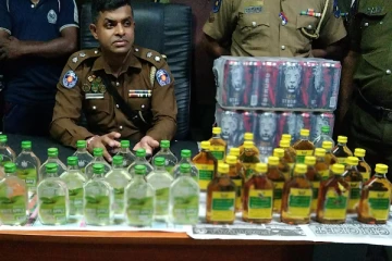 மதுபான போத்தல்களுடன் ஒருவர் கைது(Photos)