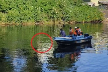 குழந்தையுடன் நீர்த்தேக்கத்தில் குதித்த பெண்