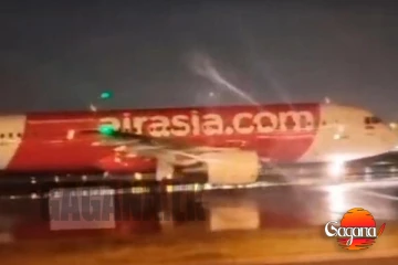 එයාර් ඒෂියා යානයක උඩු ගුවනෙදි දරුණු ගින්නක්, මුළු යානයම අඳුරේ