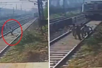 දුම්රියට බෙල්ල තියන්න ආ පුද්ගලයා 99න් බේරුණු හැටි මෙන්න...සංවේදී අය නැරඹීමෙන් වළකින්න(VIDEO)