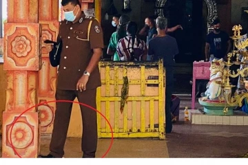 யாழ் செல்வச் சந்நிதி முருகன் ஆலயத்தில் சர்ச்சையை ஏற்படுத்திய பொலிஸ் அதிகாரியின் செயல்