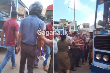 පොලීසියේ ඇස් ඉදිරිපිටම ඇවිලුණු බස් වළිය - (VIDEO)