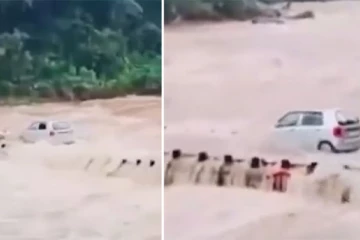 வெள்ளப்பெருக்கில் மூழ்கிய பாலம் - நிறைமாத கர்ப்பிணி மனைவியை காப்பாற்றிய கணவர்