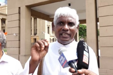 கொலைக்குற்றவாளியை விடுவிக்க அரசாங்கம் மேற்கொண்ட நாடகம் -அருட்தந்தை மாரிமுத்து சத்திவேல் குற்றச்சாட்டு