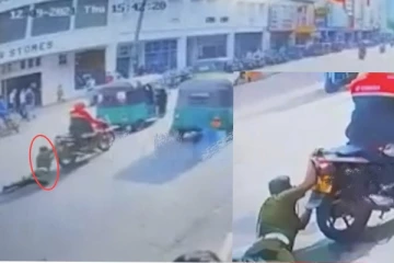 පොලිස් නිලධාරියෙක් මීටර් 70ක් මහ පාරෙ ඇඳ ගෙන යයි..විශාල පිරිසක් එක්වී සැකකරු අල්ලා ගනී.(CCTV VIDEO)
