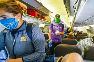 அமெரிக்க பயணிகளுக்கு முகக் கவசம் கட்டாயம்!