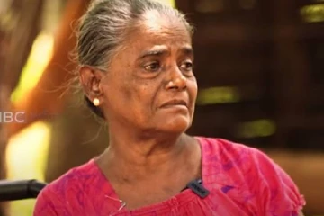 போரின் வடுக்களுடன்  13 வருடங்கள் சன்னங்களோடு சக்கர நாாற்காலியில் வாழும் தாய்