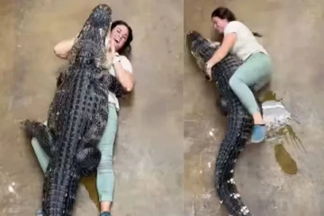 இளம் அழகியை கட்டிப்பிடித்து கொஞ்சும் முதலை: வாய் பிளக்க வைத்த வீடியோ காட்சிகள்