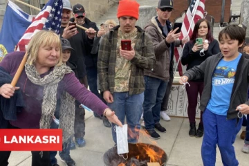 'முகக்கவசம் அணியமாட்டோம்' கேபிடல் வாசலில் தீயிலிட்டு எரித்து மக்கள் போராட்டம்