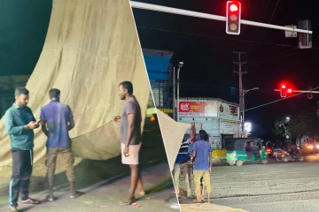 யாழில் வீதி சமிக்ஞை விளக்குகளில் காத்திருப்போருக்கு நிழல் தரும் வகையில் கட்டப்பட்ட சாக்கு படல்கள்