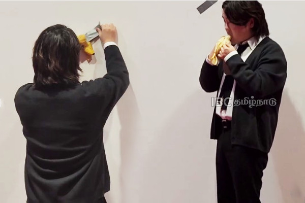 hungry-student-eats-artwork-banana-duct-taped-wall