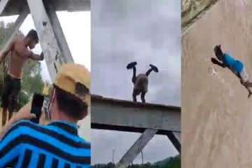 பாலத்தில் இருந்து  வெள்ள நீரில் குதிக்கும் இளைஞர்கள்;   கடும் விமர்சனம்