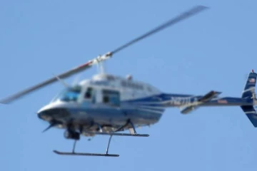 ஹெலிகாப்டரில் வந்து பொலிஸில் சரணடைந்த வாலிபர்