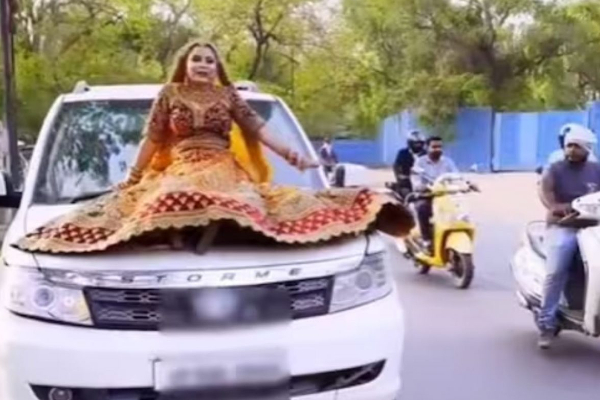 காரில் இப்படியா ஊர்வலம் போவாங்க; மணமகளுக்கு அபராதம் - வைரல் வீடியோ | Up Brides Car Ride Rs 15000 Fine Viral Video