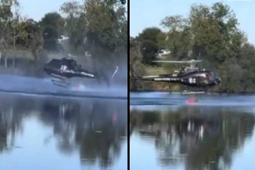 காட்டுத்தீயை அணைக்க தண்ணீர் சேகரித்தபோது ஏரிக்குள் விழுந்த ஹெலிகாப்டர்; வைரல் வீடியோ