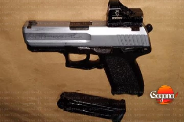 හිස් ඉඩමකින් ගිනි අවියක් මතුවෙයි - කරපු දේ CCTV කැමරාවේ