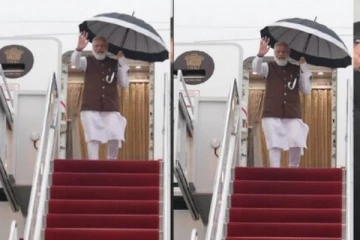 அமெரிக்காவில்  விமானத்தில் இருந்து குடையுடன் இறங்கிய மோடி!