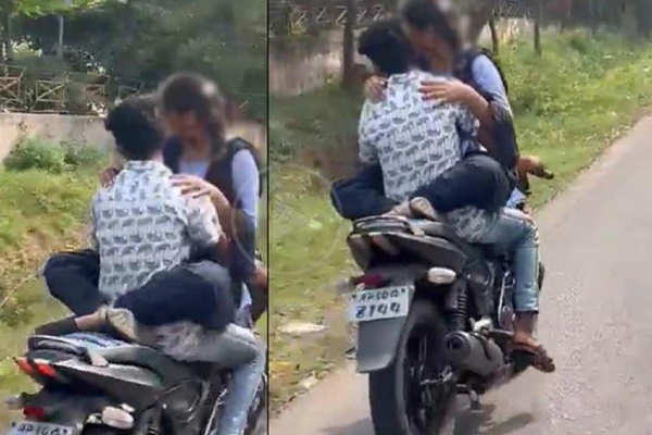 பெட்ரோல் தாங்கியில் அமர்ந்து மோட்டார் சைக்கிளை செலுத்திய காதல் ஜோடி | Couple Driving Motorcycle Sitting On A Petrol Tank