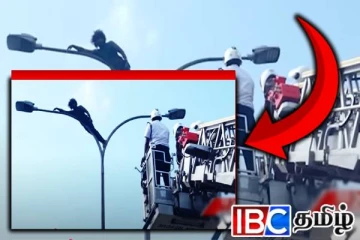 கொழும்பில் மின்கம்பத்தில் ஏறிய நபர்: இறங்க வைக்க சிரமப்பட்ட காவல்துறையினர்