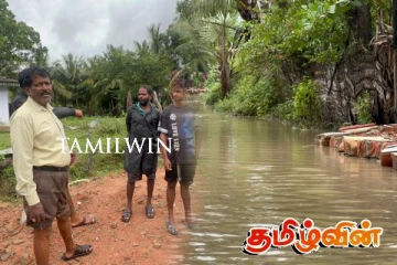 வெள்ள நீரில் மூழ்கிய புதுக்குடியிருப்பு வீதி:விடுக்கப்பட்டுள்ள கோரிக்கை