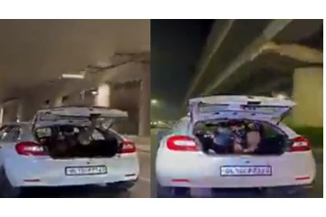 ஓடும் காரிலிருந்து ரூபாய் நோட்டுக்களை வாரி வாரி வீசிய நபர்... - வைரல் வீடியோ...!