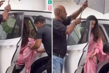 குடைபிடிக்க ஒருவர், சேலையை பிடிக்க இன்னொருவர்.. எல்லைமீறும் நடிகையை வறுத்தெடுத்த நெட்டிசன்கள்