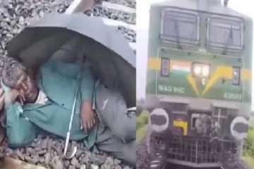 தண்டவாளத்தில் குடை பிடித்து உறங்கிய நபர் ; வைரல் வீடியோ