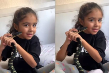 சிறுமியின் கன்னத்தில் முத்தமிட்ட கரும்பாம்பு - வைரலாகும் வீடியோ