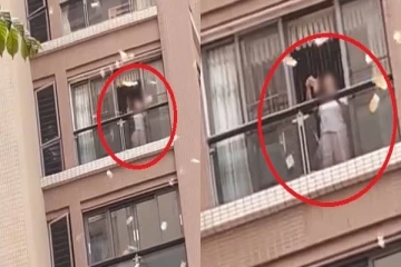 அடுக்கு மாடியில் இருந்து பணத்தை கட்டுக்கட்டாக தூக்கி வீசிய பெண் - வைரல் வீடியோ