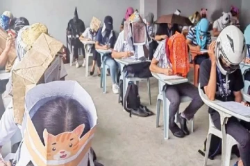 பரீட்சையில் கொப்பி அடிப்பதை தவிர்க்க மாணவர்களின் விசித்திர தொப்பிகள்