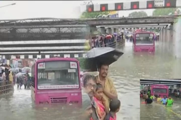 ரயில்வே பாலத்தில் தேங்கிய மழை நீரில் சிக்கிய அரசு பேருந்து - பயணிகளை மீட்ட தீயணைப்புத்துறை