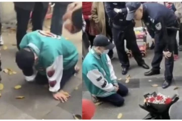 காதலியின் அலுவலகம் முன் 21 மணிநேரம் மண்டியிட்ட காதலன்!