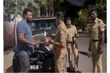 மது குடிக்காதவரிடம் அபராதம் வசூலிக்க முயன்ற போலீசார் - வாக்குவாதம் செய்த வாகன ஓட்டி