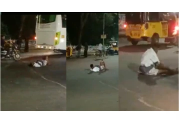 நடுரோட்டில் காலுக்கு மேல் கால் போட்டு அலப்பறை செய்த போதை ஆசாமி.. - வைரலாகும் வீடியோ...!