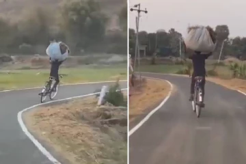 தலையில் கணமான மூட்டை... இரு கைகளையும் விட்டுட்டு சைக்கிளில் ஜாலியாக போகும் நபர்!