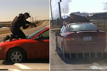 கார் மீது ஏறி துப்பாக்கியை காட்டிய பொலிஸ் அதிகாரி: இருப்பினும் வேகமாக பறந்த குற்றவாளியின் கார்