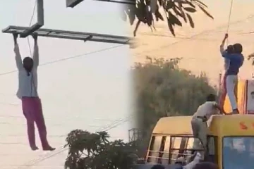 குடிபோதையில் ரகளை : விளம்பர பலகையில் தொங்கியபடி பஸ் மீது விழுந்த நபர் - வைரலாகும் வீடியோ